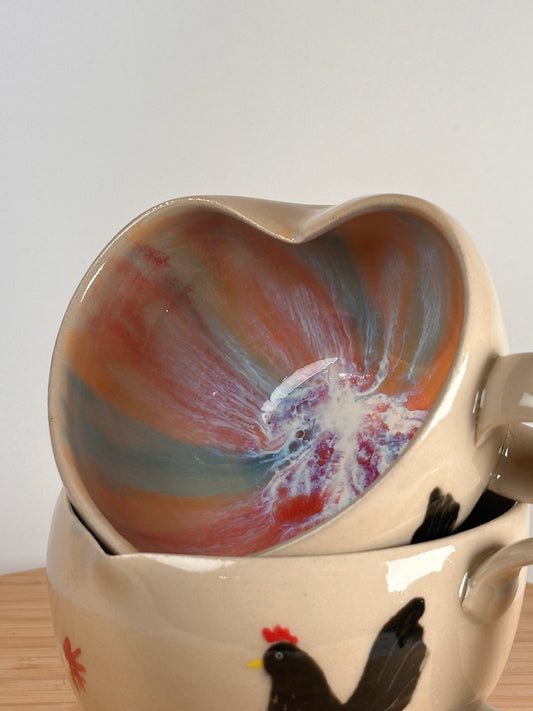 Herztasse mit vielen Hühnern